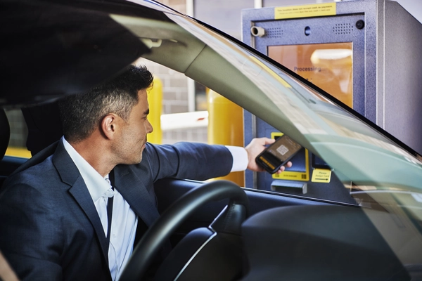 A guest scans their QR code at The Parking Spot entry kiosk.