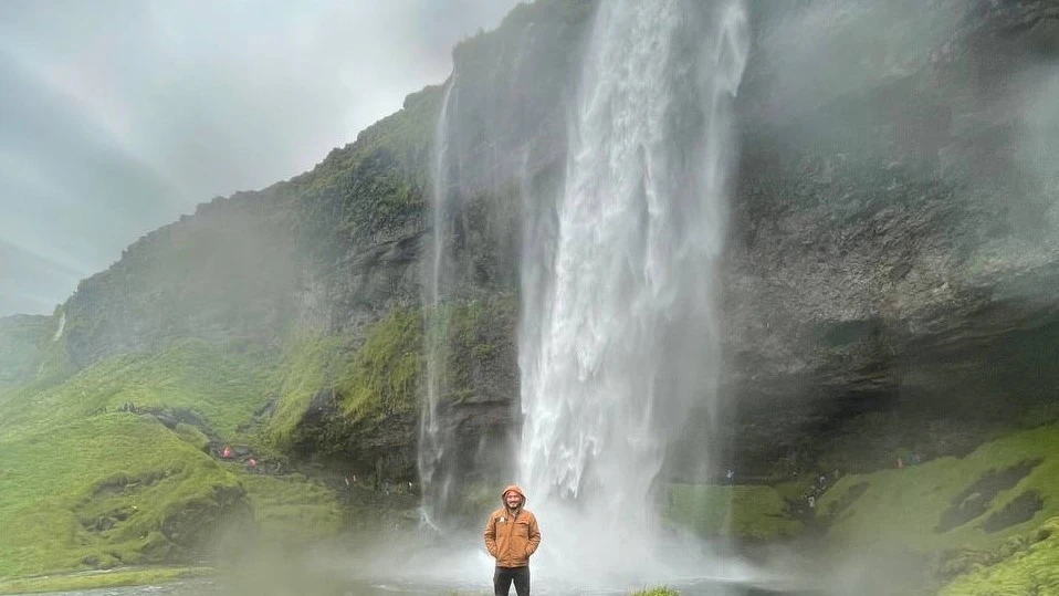 Our friend, Josh, enjoys a waterfall in Iceland