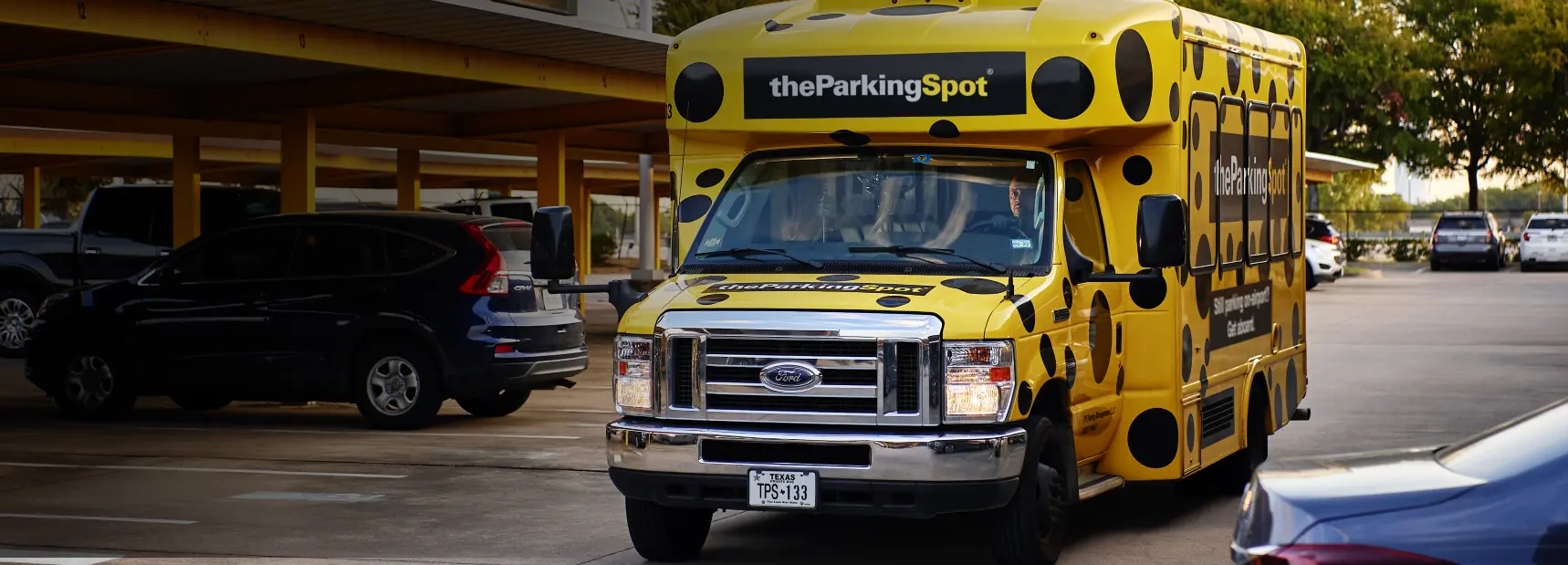 A shuttle driver at The Parking Spot in Houston picks up travelers at their vehicle