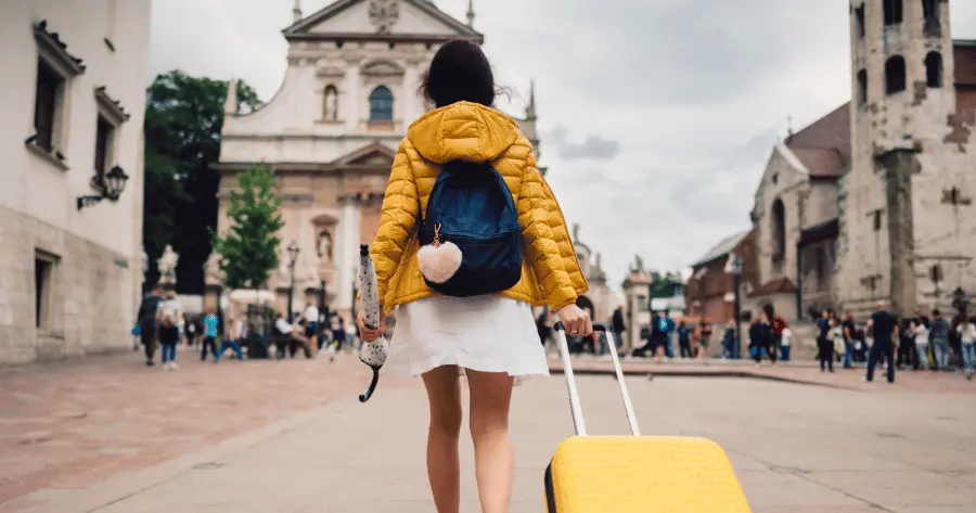 woman-walks-with-luggage.webp